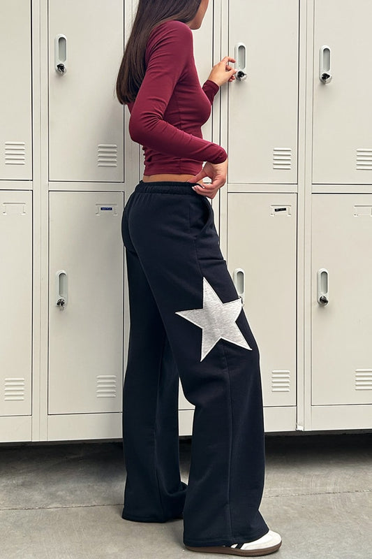 Wide-leg joggers with star | Subdued Featured